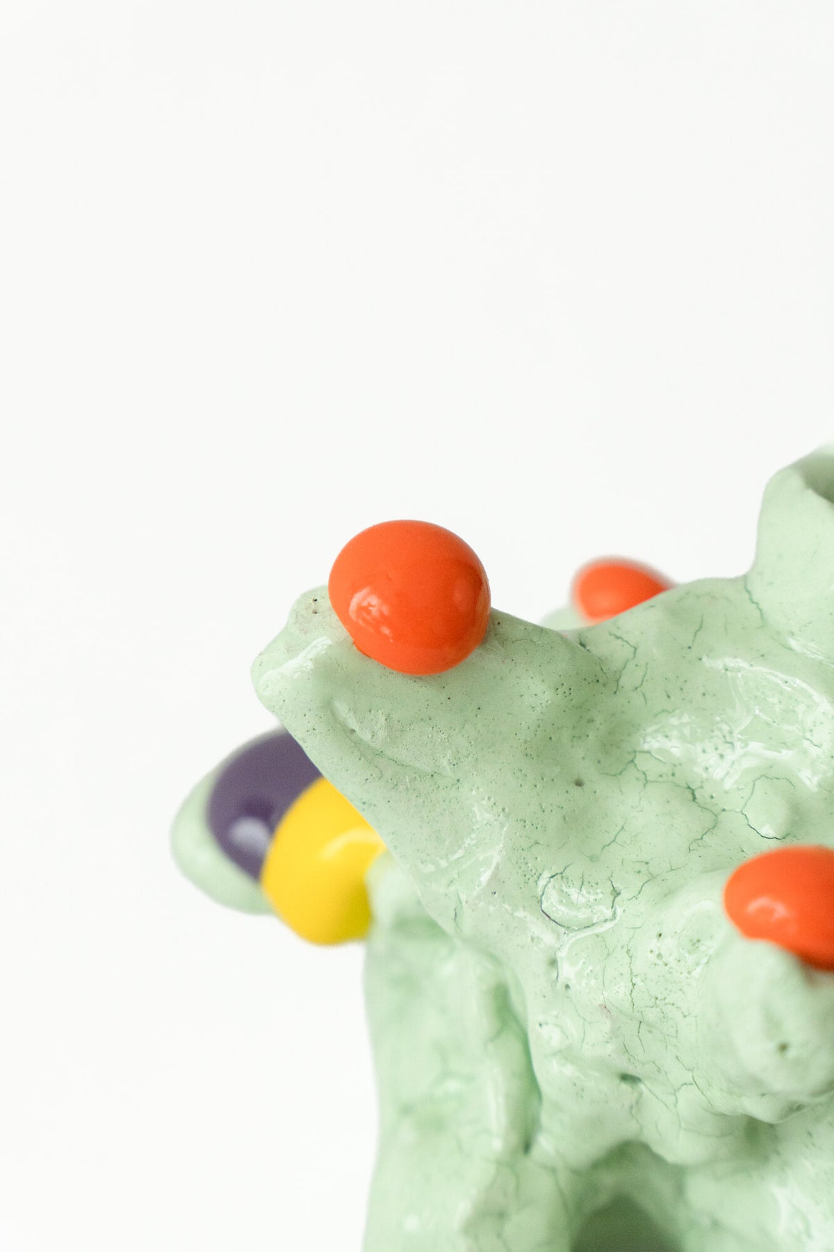 Foam #8 by Onree: Low pale green ceramic form with orange, yellow and dark accents — additional view 2
