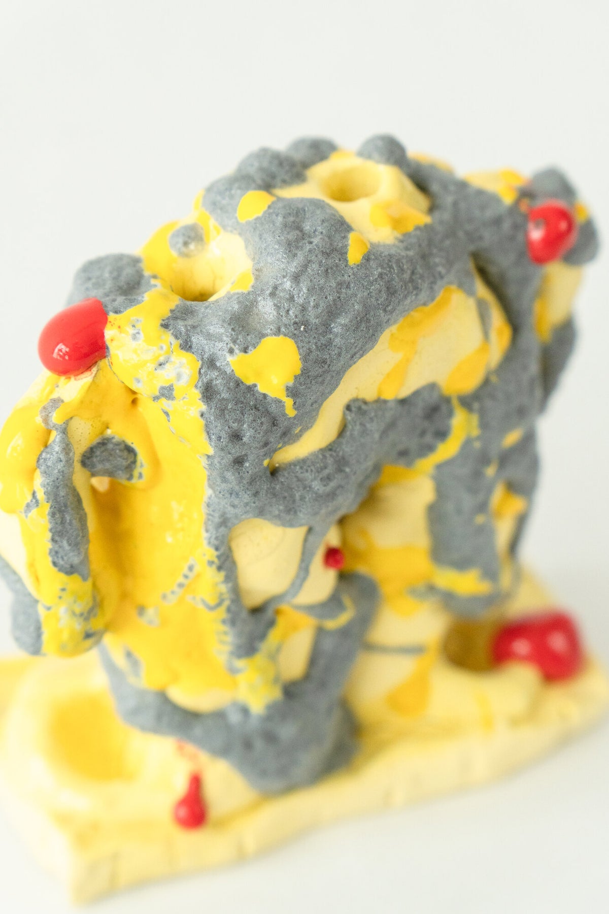 Foam #20 by Onree: Yellow ceramic vessel with coarse charcoal surfaces and small red glazed details — additional view 2