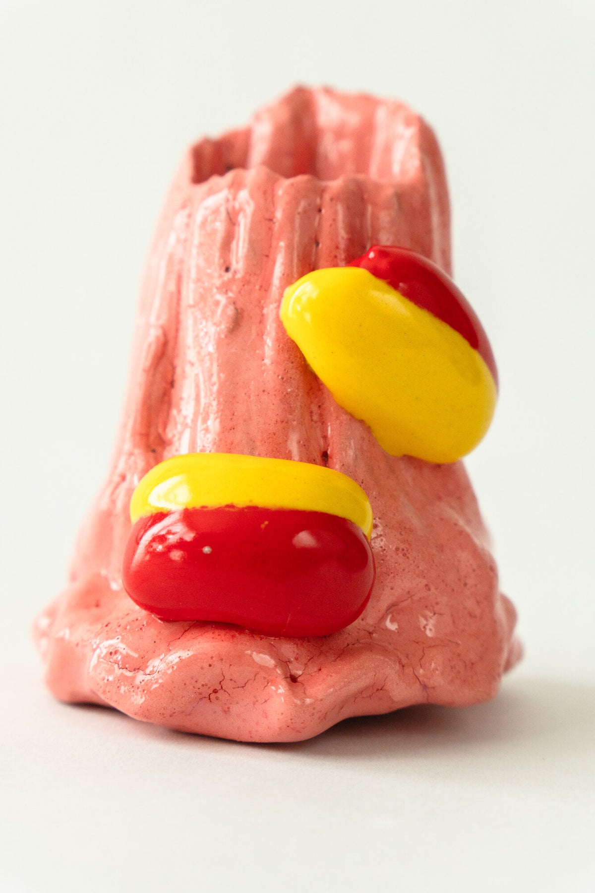 Foam #32 by Onree: Tapered pink ceramic vessel with vertical ridges and red and yellow glazed additions — additional view 1