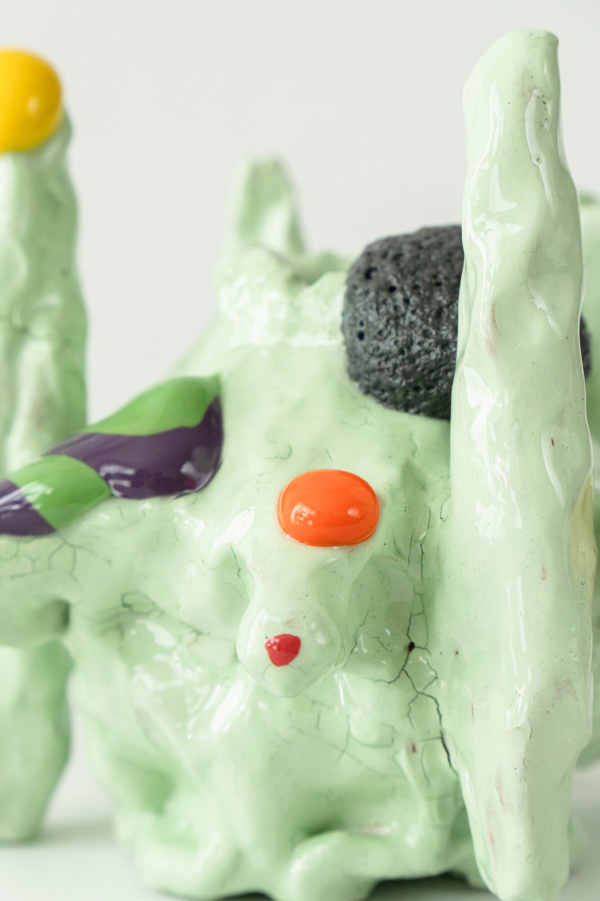 Foam #34 by Onree: Pale green ceramic form with slender upright towers and colourful raised details — additional view 2