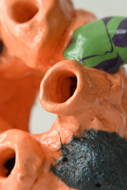 Foam #1 by Onree: Orange looping ceramic form with several openings, bright glazed accents and dark textured projections — additional view 2