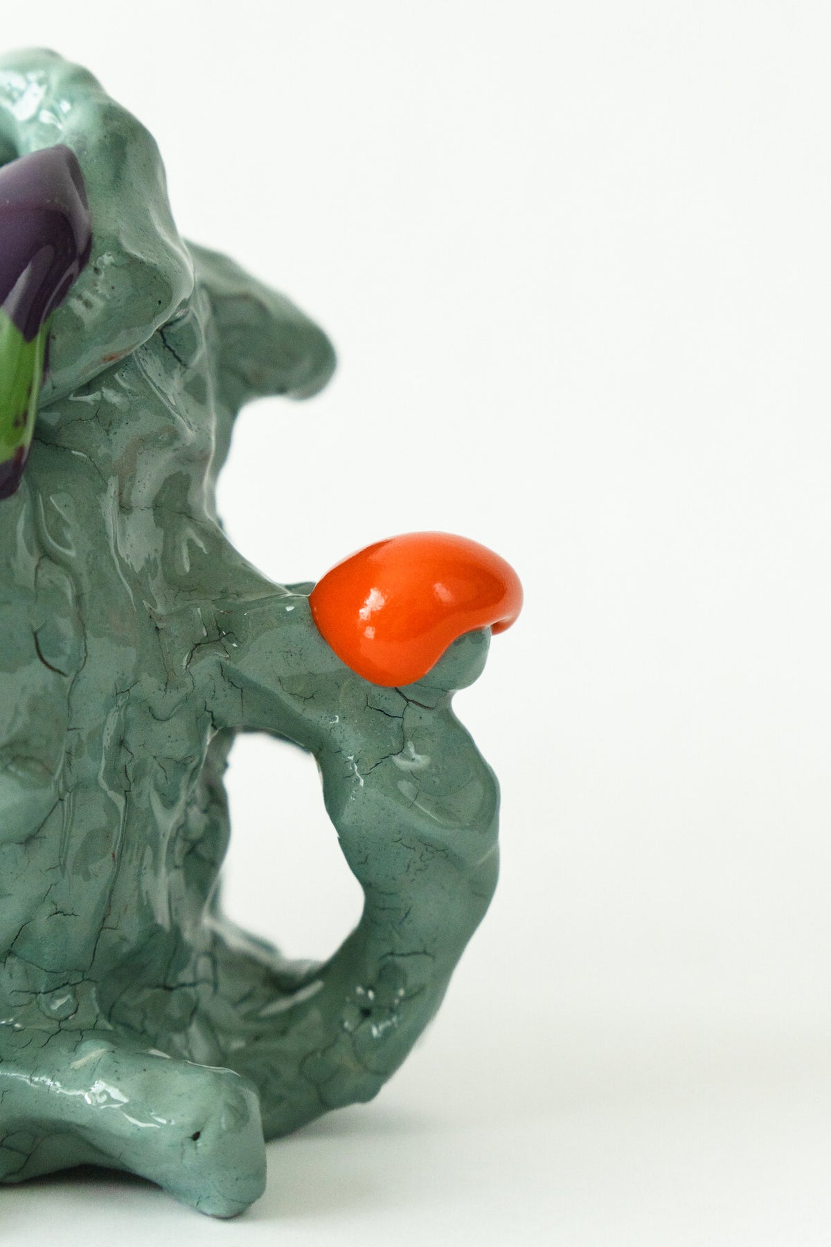 Foam #2 by Onree: Pale green ceramic vessel with an irregular body, orange and yellow accents, and a green-and-purple detail — additional view 1