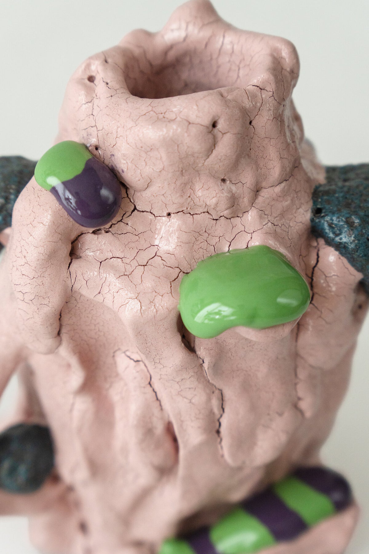 Foam #3 by Onree: Pink ceramic vessel with a folded surface and green and purple accents — additional view 1