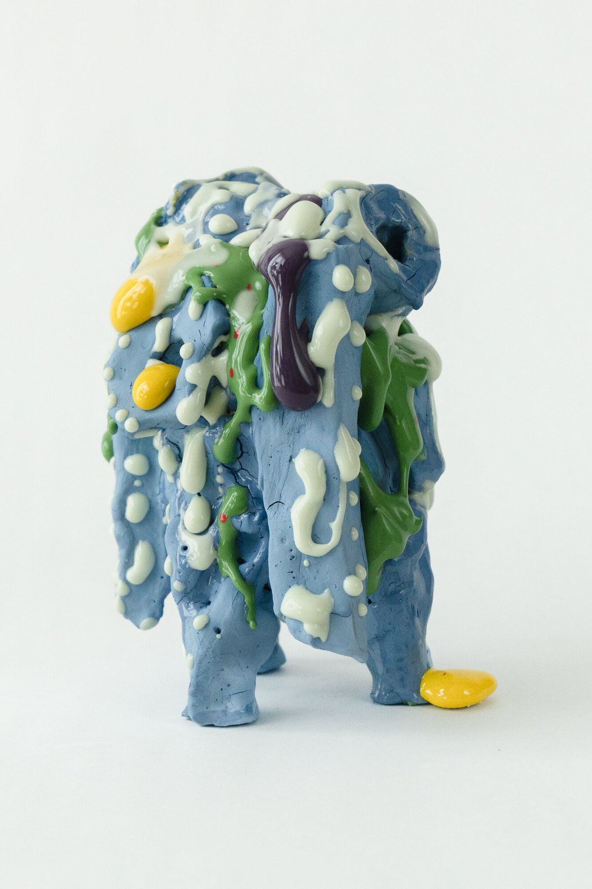 Foam #4 by Onree: Tall blue ceramic form with green and white surface details and bright yellow accents — full view