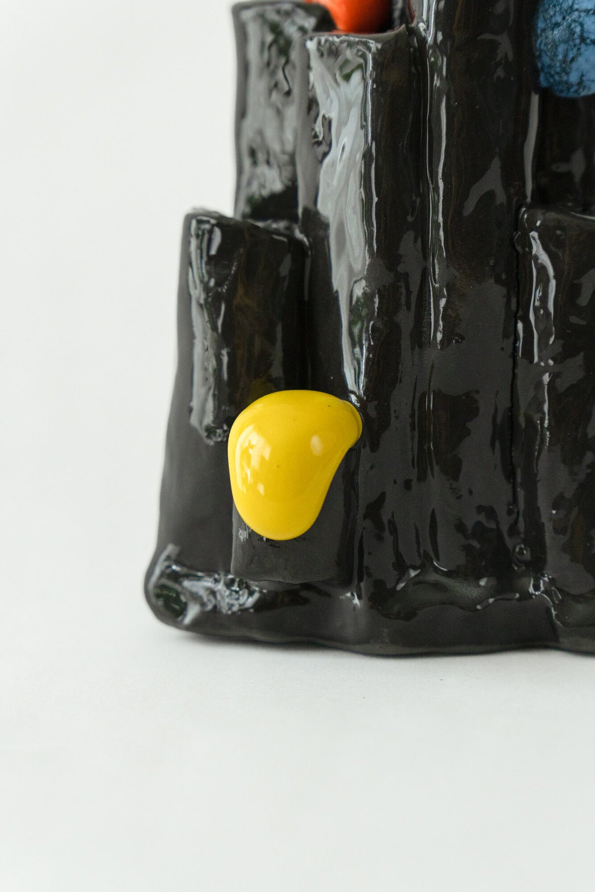 Foam #5 by Onree: Glossy black ceramic tubes with orange and yellow details and a textured blue disc — additional view 3