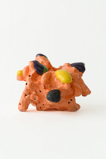Foam #7 by Onree: Compact orange ceramic form with dark textured projections and yellow accents — full view