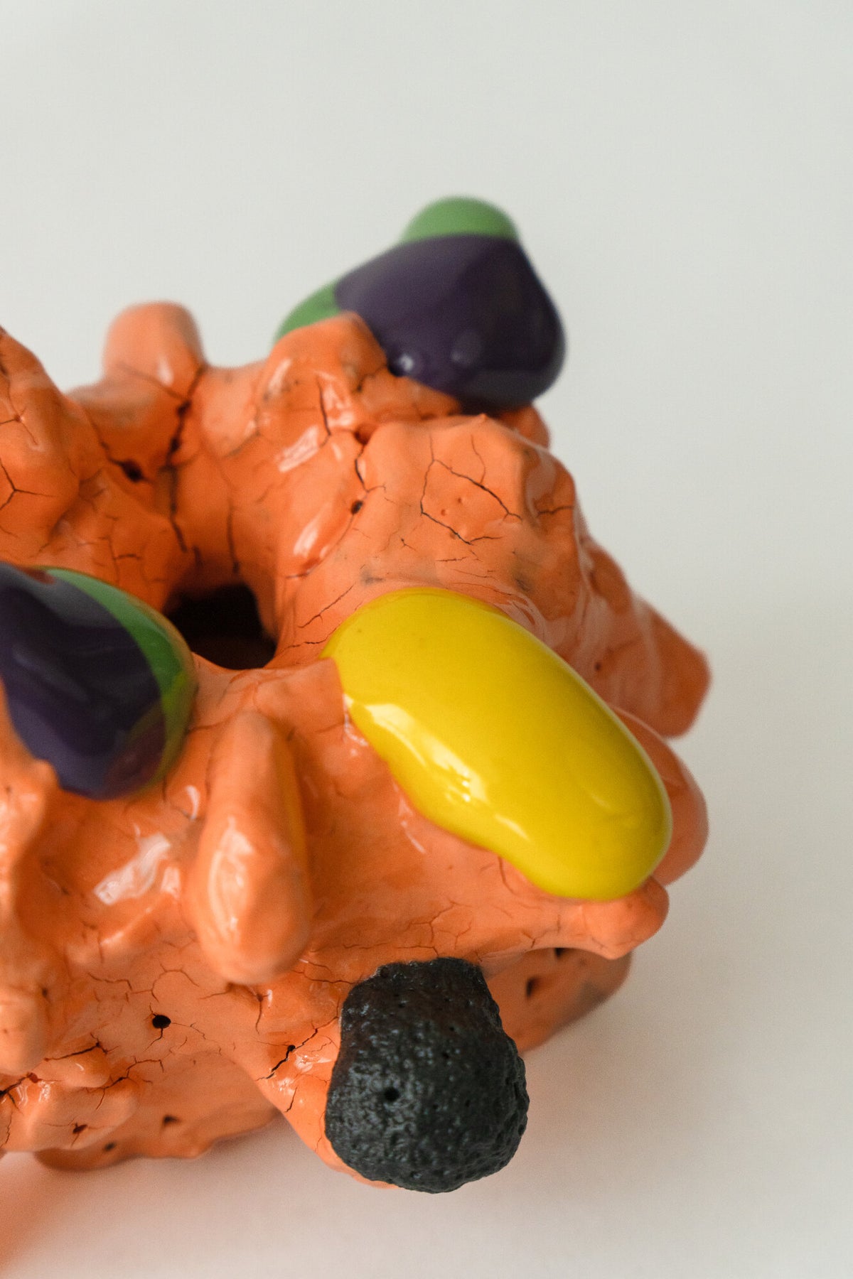 Foam #7 by Onree: Compact orange ceramic form with dark textured projections and yellow accents — additional view 1