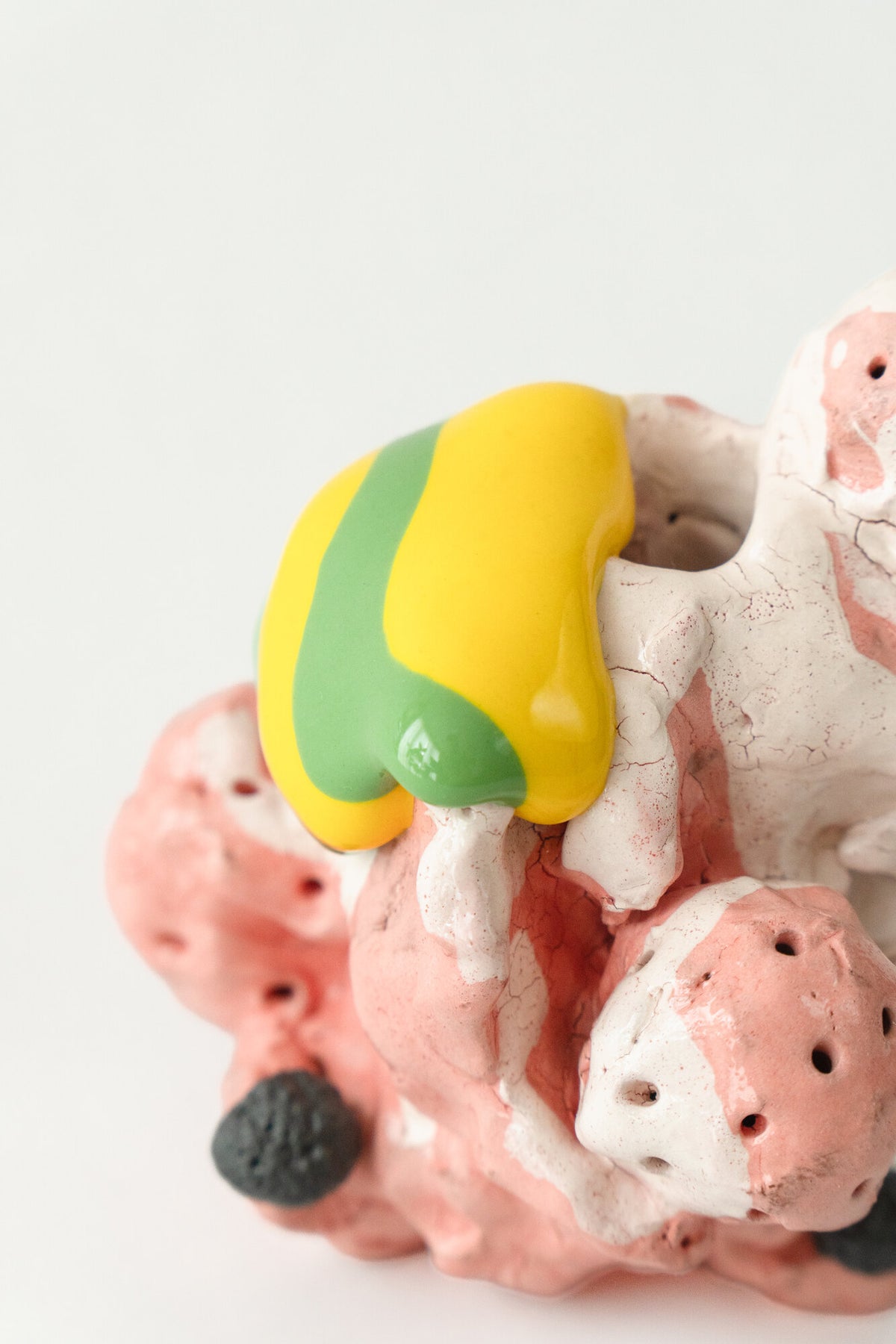 Foam #10 by Onree: Pink and cream ceramic form with small openings and a yellow-and-green accent — additional view 1
