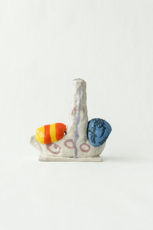 Foam #11 by Onree: Cream ceramic spire with pink circles, an orange-and-yellow striped detail, and a blue disc — full view