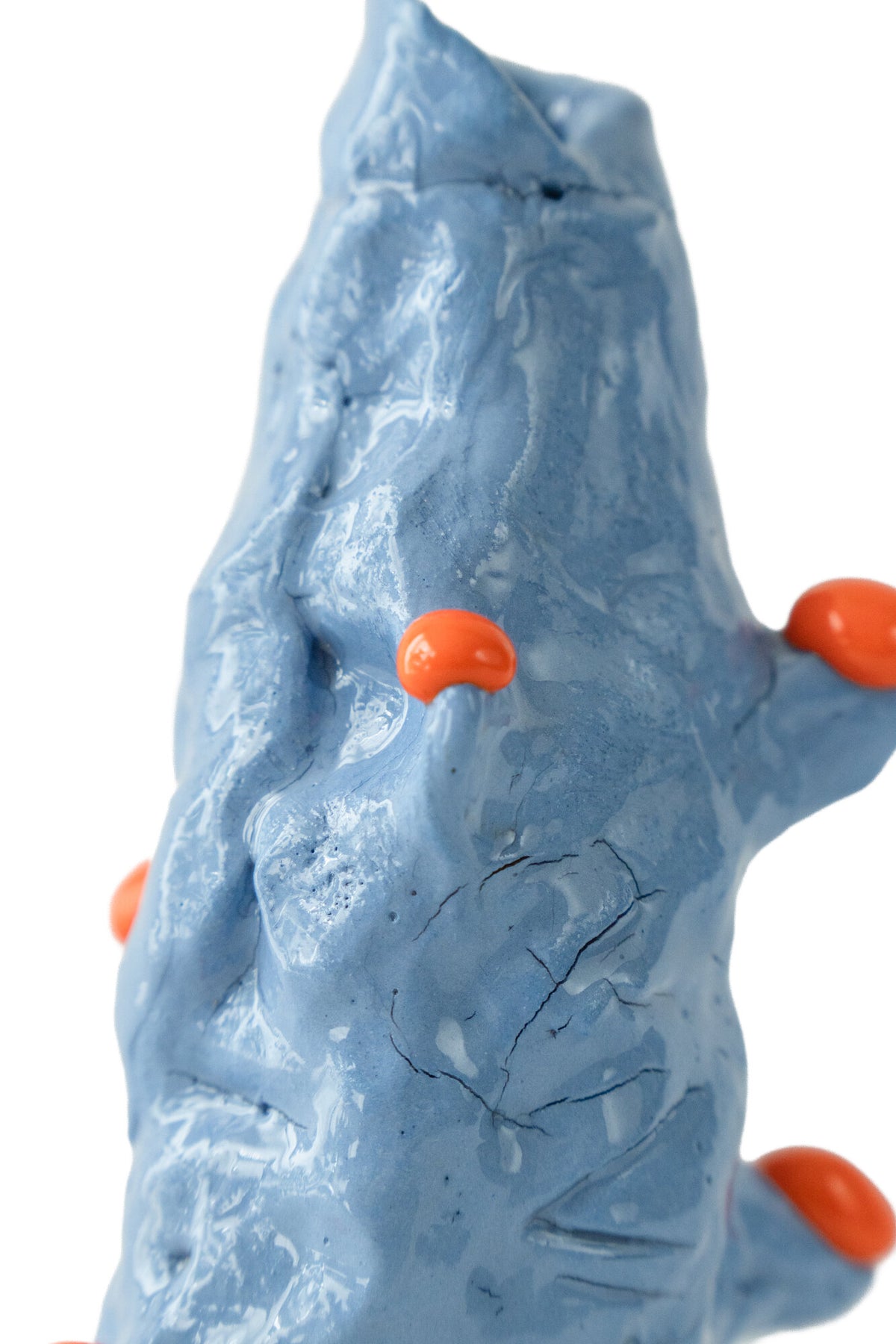 Foam #12 by Onree: Tall blue ceramic form with folded ridges and bright orange protrusions — additional view 1
