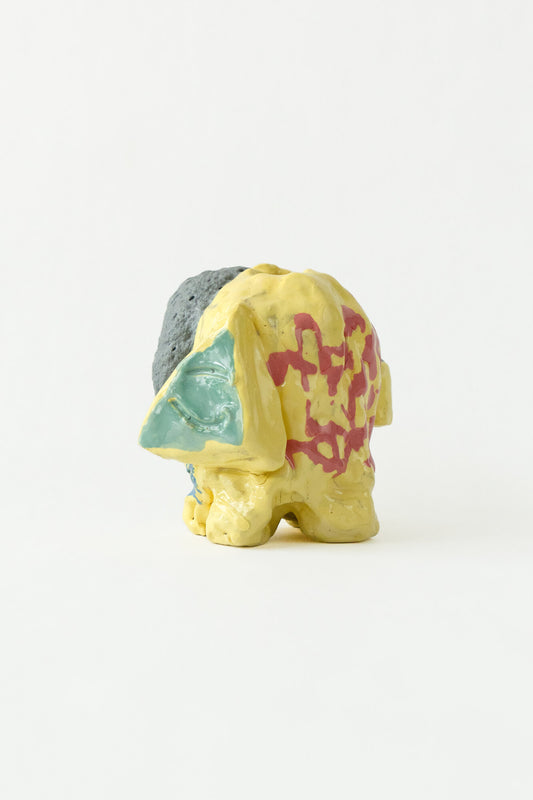 Foam #13 by Onree: Yellow ceramic vessel with red markings, a pale green detail and a dark textured section — full view