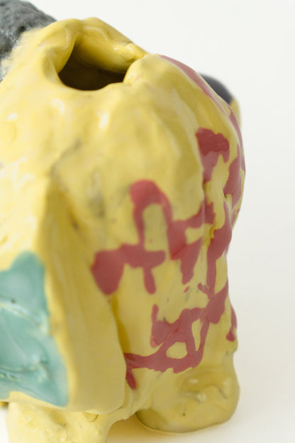 Foam #13 by Onree: Yellow ceramic vessel with red markings, a pale green detail and a dark textured section — additional view 1