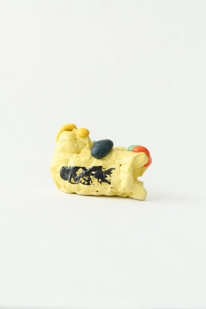 Foam #15 by Onree: Low yellow ceramic form with a black band and dark textured accents — full view