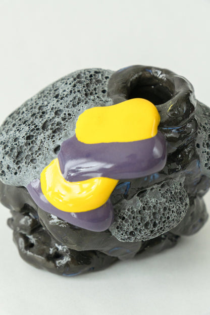 Foam #16 by Onree: Compact black ceramic form with textured grey details and yellow and purple glaze — additional view 1