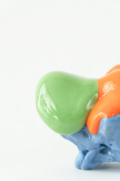 Foam #19 by Onree: Low blue ceramic form with orange glaze, a green projection and a dark textured disc — additional view 1