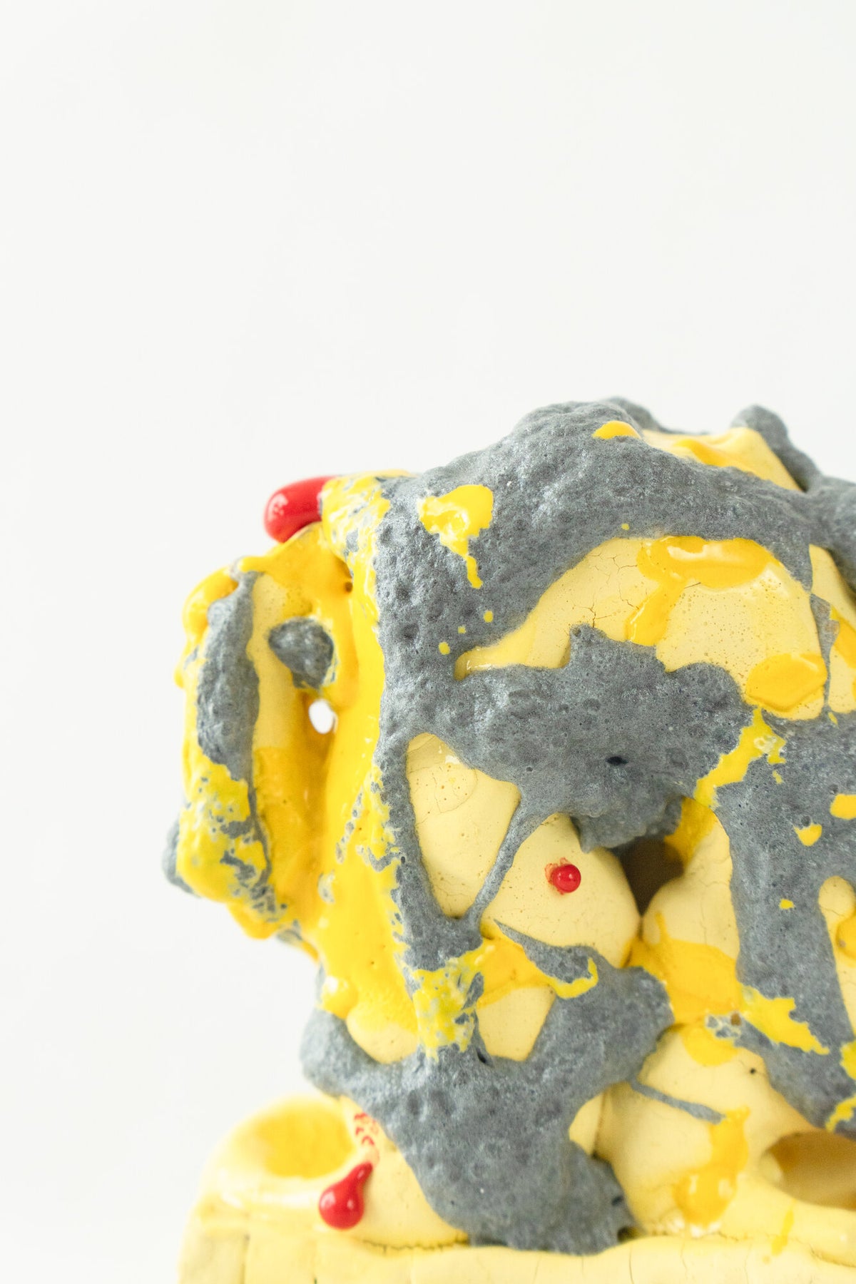 Foam #20 by Onree: Yellow ceramic vessel with coarse charcoal surfaces and small red glazed details — additional view 1