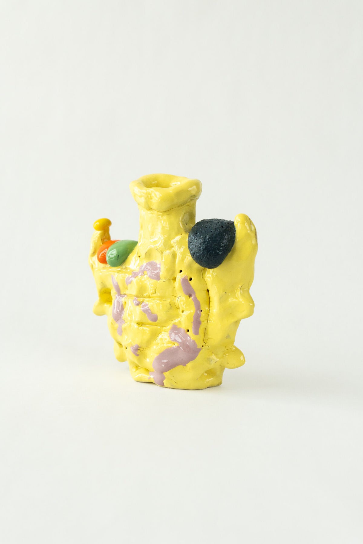 Foam #22 by Onree: Upright yellow ceramic vessel with lavender marks and contrasting raised details — full view