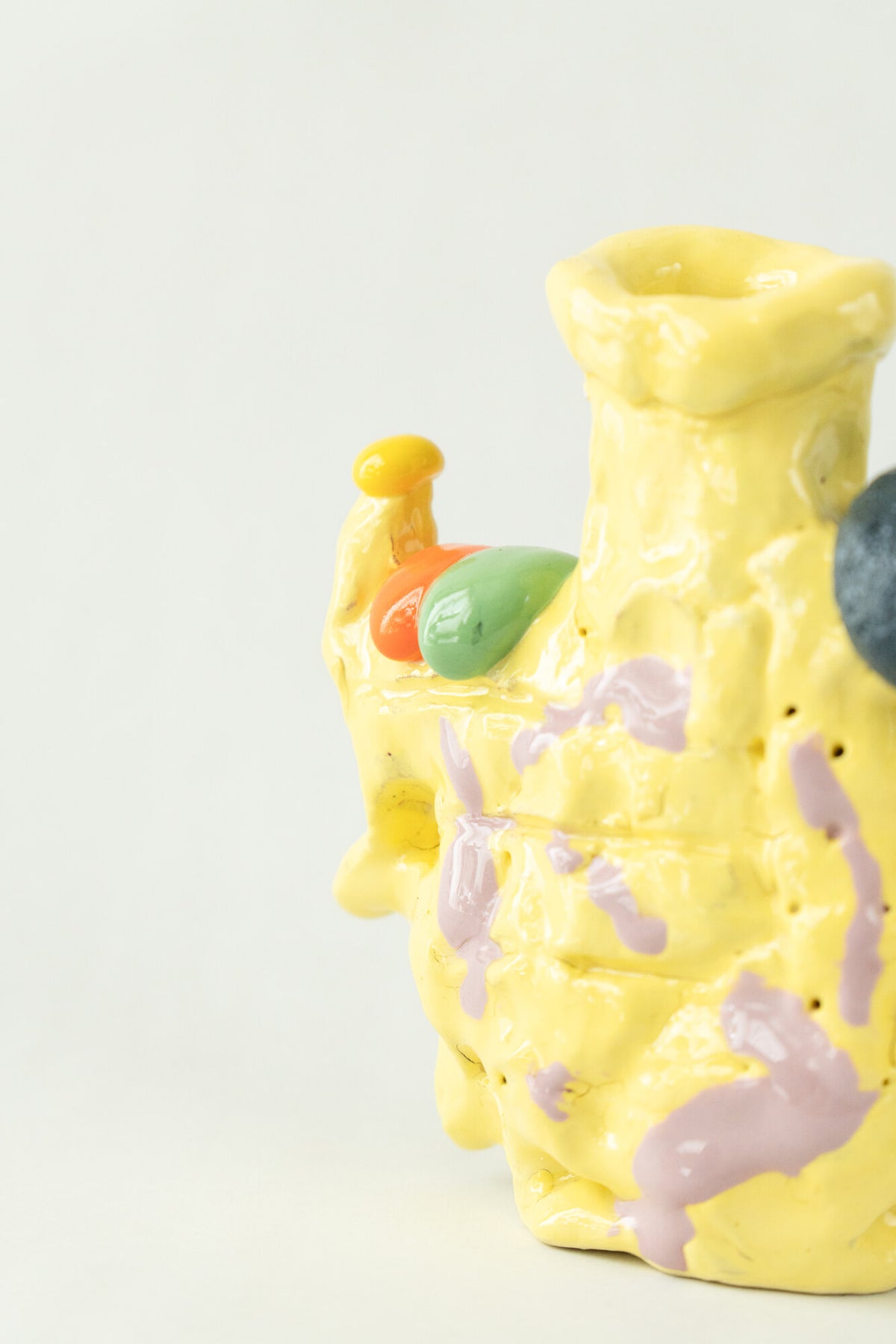 Foam #22 by Onree: Upright yellow ceramic vessel with lavender marks and contrasting raised details — additional view 1