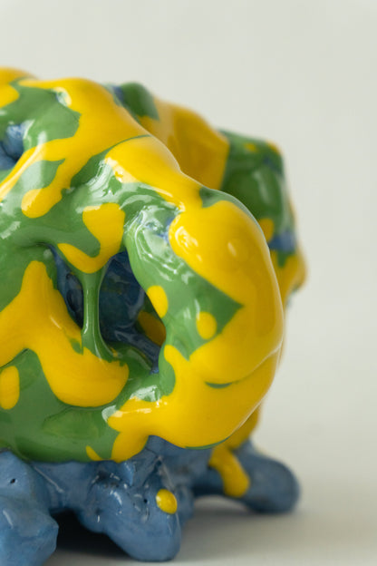 Foam #25 by Onree: Compact blue ceramic form covered in green and yellow glaze — additional view 1