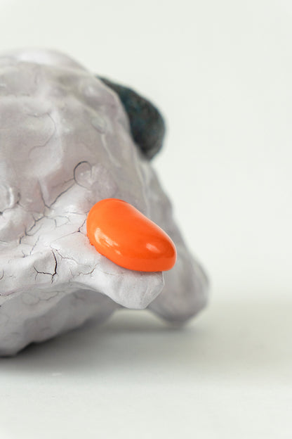 Foam #29 by Onree: Low white ceramic form with green, yellow and orange glaze and a dark textured detail — additional view 1