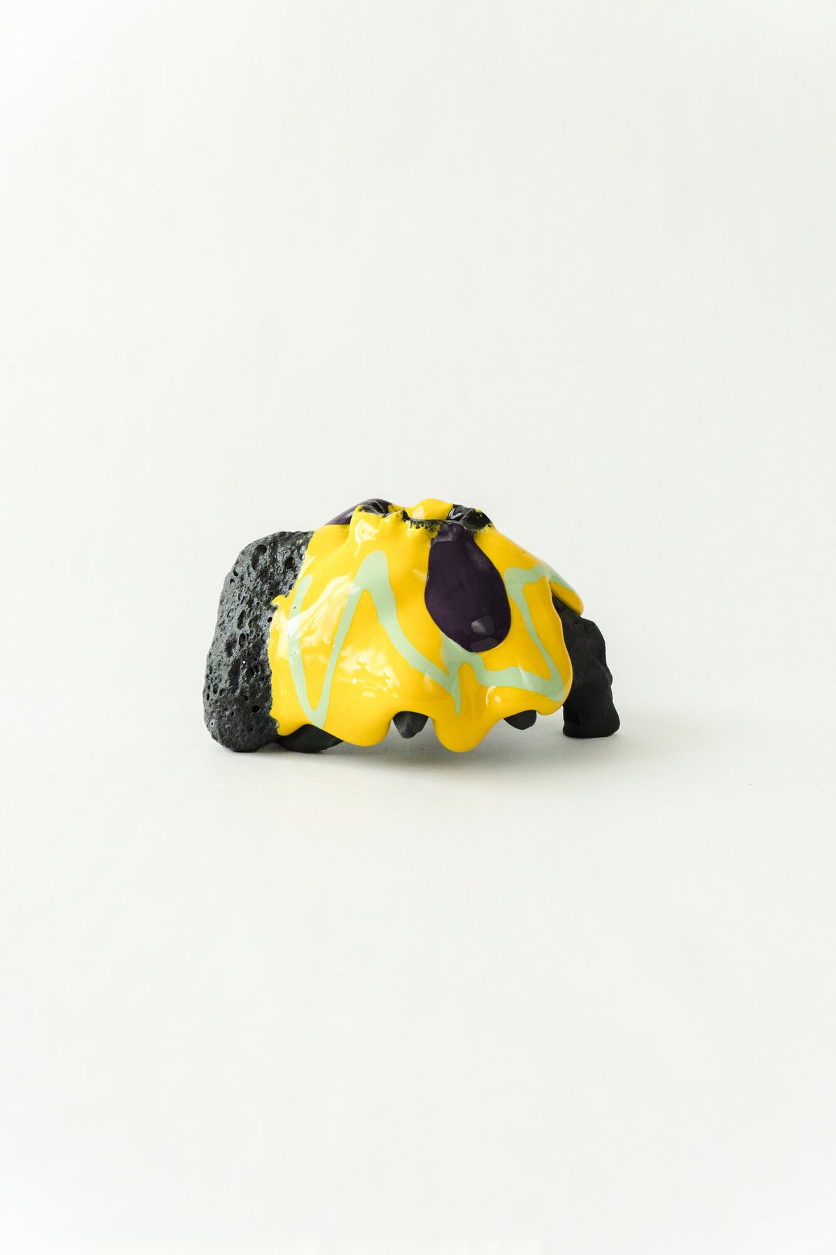 Foam #31 by Onree: Low black ceramic form with yellow, pale green and purple glaze — additional view 1