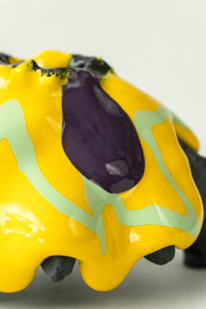 Foam #31 by Onree: Low black ceramic form with yellow, pale green and purple glaze — additional view 4